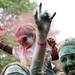 A young participant throws paint in the air during the Ypsilanti Color Run concert on Saturday, May 11. Daniel Brenner I AnnArbor.com